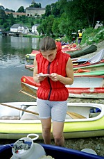 Frozen Carol, no longer making fun of life jackets, is trying to decipher from a map, how we ever going to ride that dam