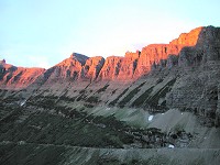 Mountain barrier, illuminated by setting sun