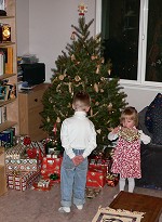 Kids getting ready to unwrap their Christmas presents