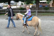 Lisa riding a pony
