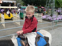 Tom riding a pony