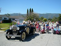 A veteran car at the head of the parade. A veteran car at the head of the parade.