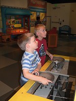 Buddies at a machine Buddies at a machine