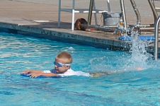 Tom in a swimming class.