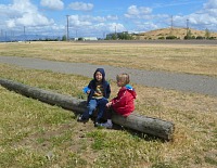 Lisa devoutly watching Jack flying his kite.