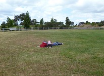 Indians camouflaging in the grass.