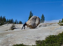 Jana pushing a rock.