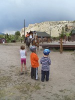 Younger riders impatiently await the return of the first shift.