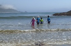 Kids in the surf on Molera Beach Kids in the surf on Molera Beach