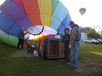 Tom seriously discusses something with pilot Mike during balloon build-up. Tom seriously discusses something with pilot Mike during balloon build-up.
