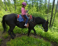 Lisa on a horse in Montana. Lisa on a horse in Montana.