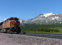 A BNSF train rolling east through Marias Pass, Montana. A BNSF train rolling east through Marias Pass, Montana.