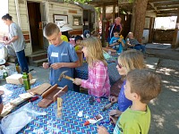 Bear Creek children put together houses for endangered bats.