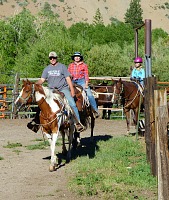 Girls return from their spontaneous ride among the wildflowers.