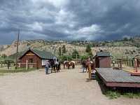 Carol, Lisa and cowboys leaving into the storm at Leavitt Meadows Pack Station.