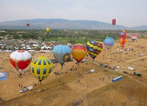 Over port-a-potties, balloons, and vendor booths.