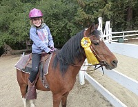 Lisa and Tony Pony have won their first ribbon. Lisa and Tony Pony have won their first ribbon.