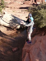 The kids are having a blast because of a piece of ice at Red Rock Canyon, Nevada.