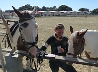 Left to right: Cody, coach Makayla and a mare named Jacy. Left to right: Cody, coach Makayla and a mare named Jacy.