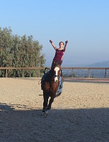 Lisa on a cantering horse. Lisa on a cantering horse.