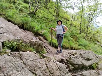 Carol prepares to ascend along a chain to Månafossen waterfalls.