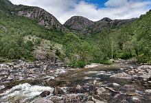 A pretty creek, Frafjordelva, flows out of the waterfalls.